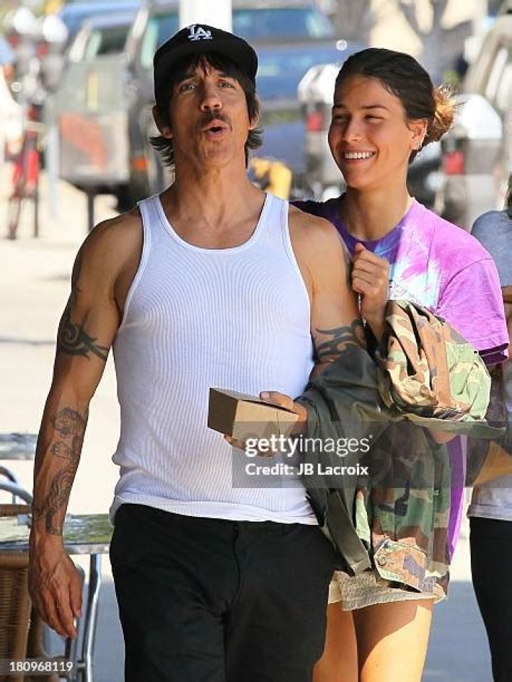 Anthony Kiedis and girlfriend Helena Vestergaard walk in each other's