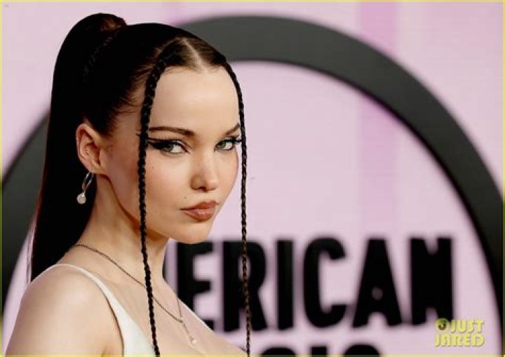 Dove Cameron Shows Off Her Sultry Slithering Tattoo In Snaky Green Dress