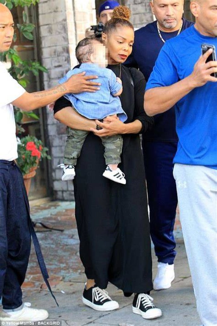 Jackson carries her baby boy Eissa in her arms after having lunch