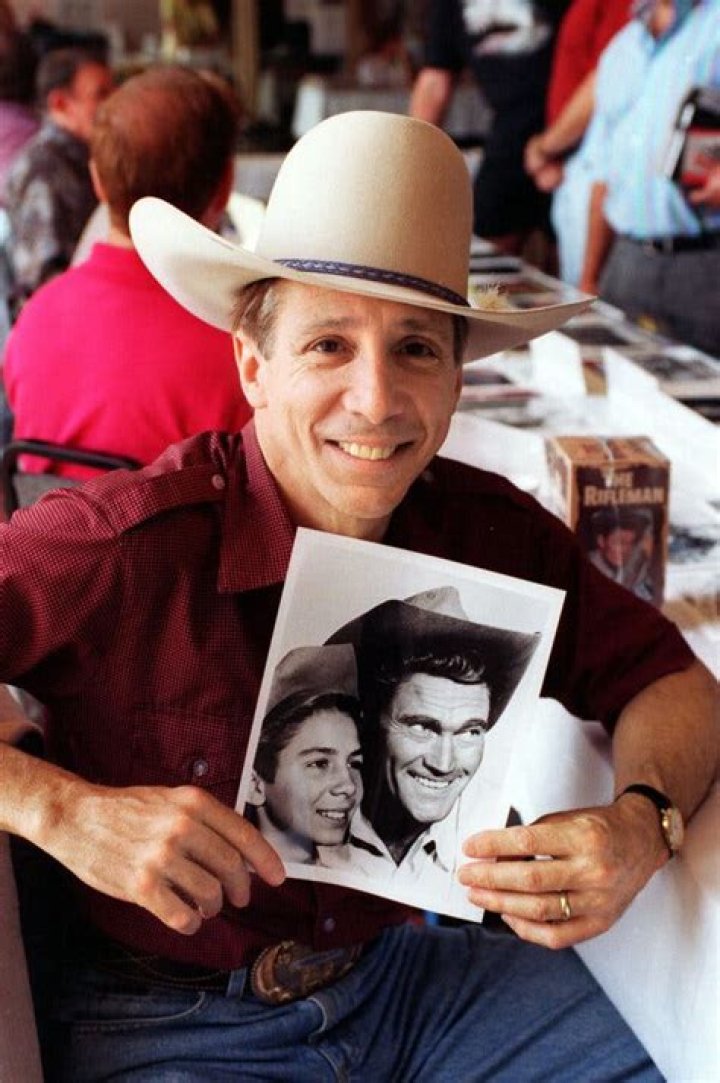 Johnny Crawford in 1997 with a photo of himself as a boy and Chuck