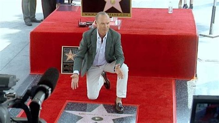 Michael Keaton gets smooch from lady friend at Hollywood star ceremony