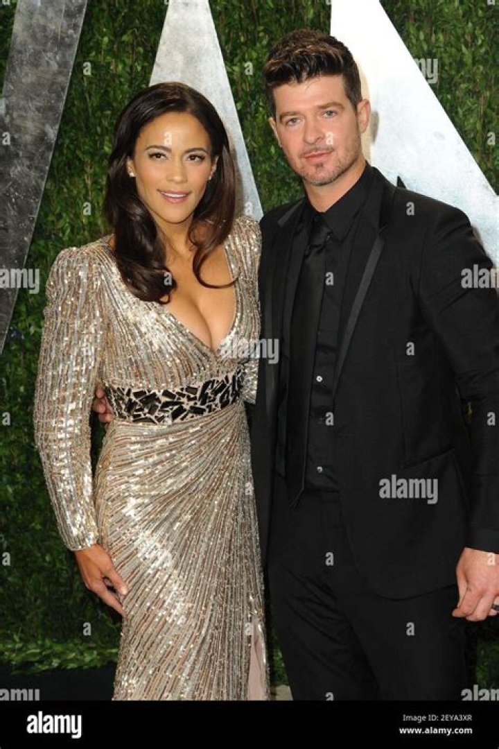 Paula Patton and husband Robin Thicke arrive at the Keep a Child Alive