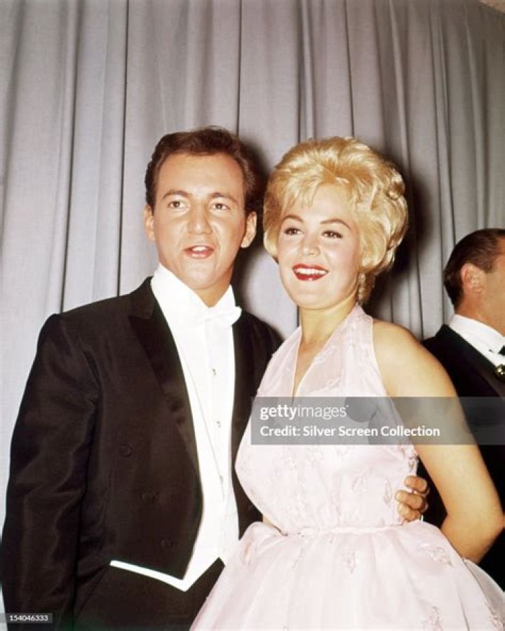 Singer Bobby Darin and his wife Andrea Yeager, attending a share