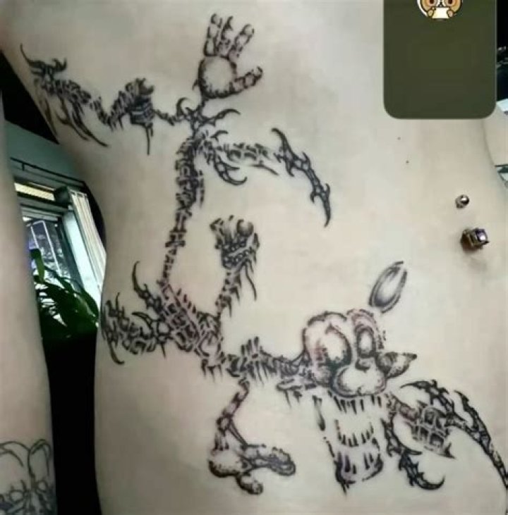 stomach tattoo sun funky face floral chrysanthemum Side Stomach Tattoos