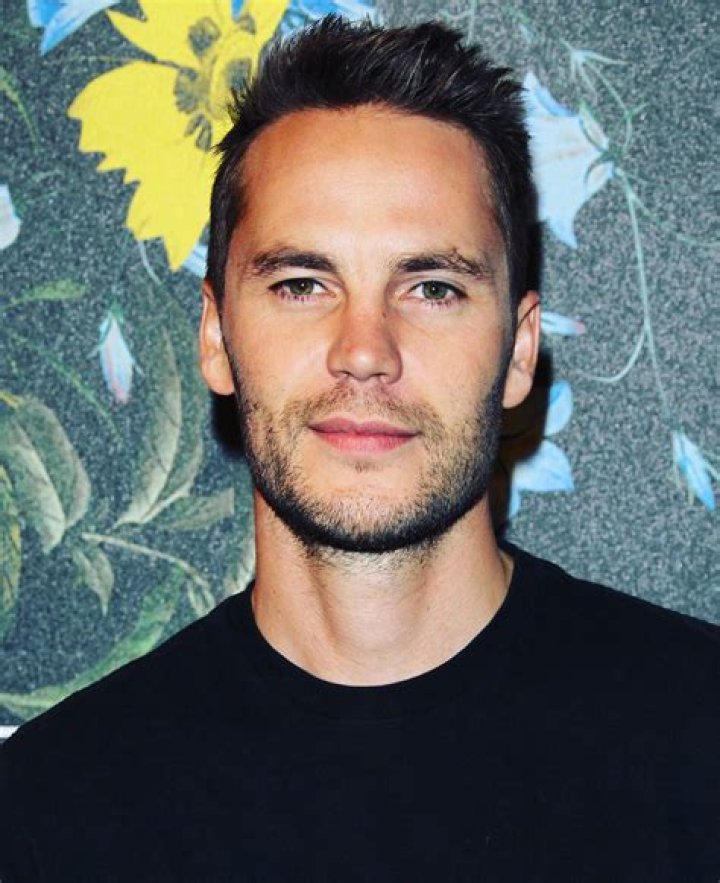 Taylor Kitsch with short hair and girlfriend with Connie Britton at